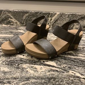 Size 8 black and brown wedges with snake print design. Boutique by Corkys.